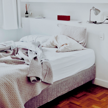 a bedroom, with a messy bed. snoring and tmj